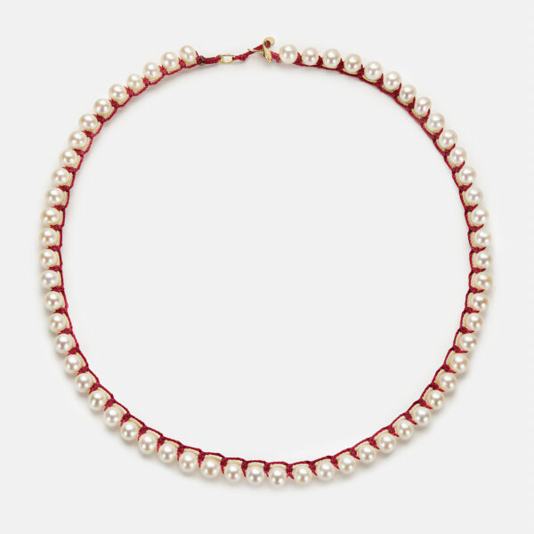 Embroidered moon gold colored "heartbeat" necklace with white freshwater pearls 5.5-6mm with beige and dark red cord