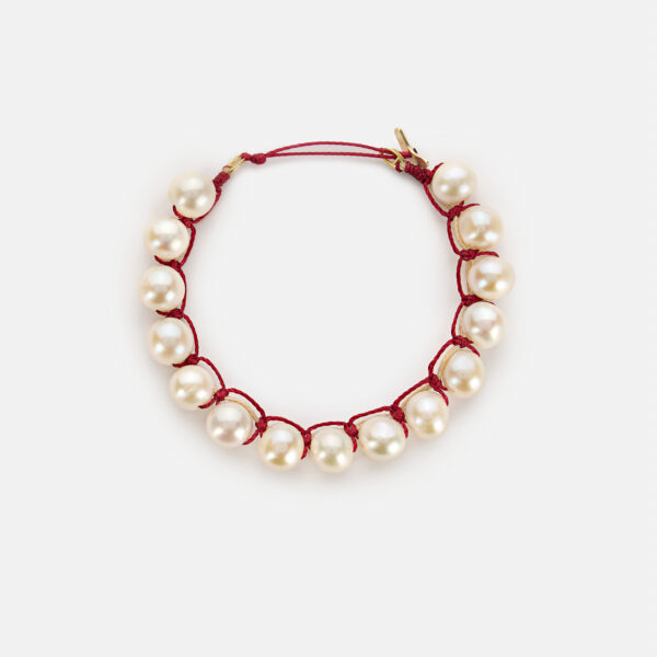 Embroidered moon gold colored "heartbeat" bracelet with white freshwater pearls 8-8.5mm with beige and dark red cord