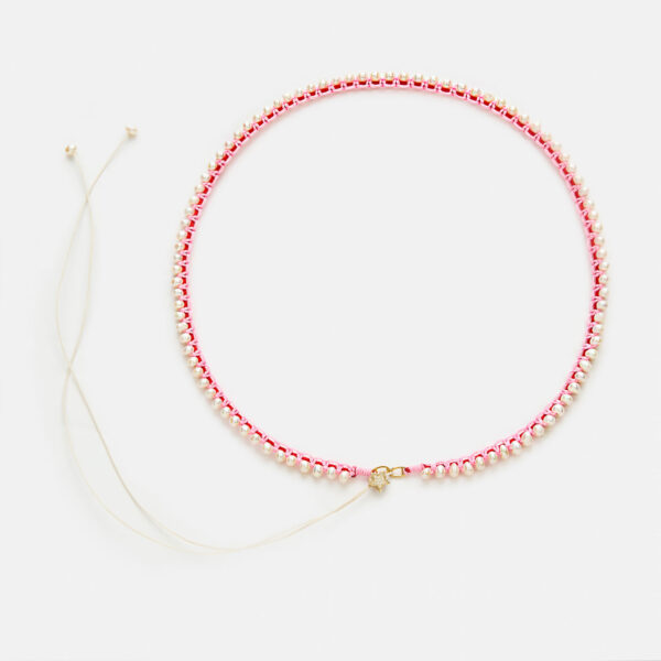 Embroidered superstar gold colored "pulse" necklace with white freshwater pearls 3.5-4.5mm with red and pink cord